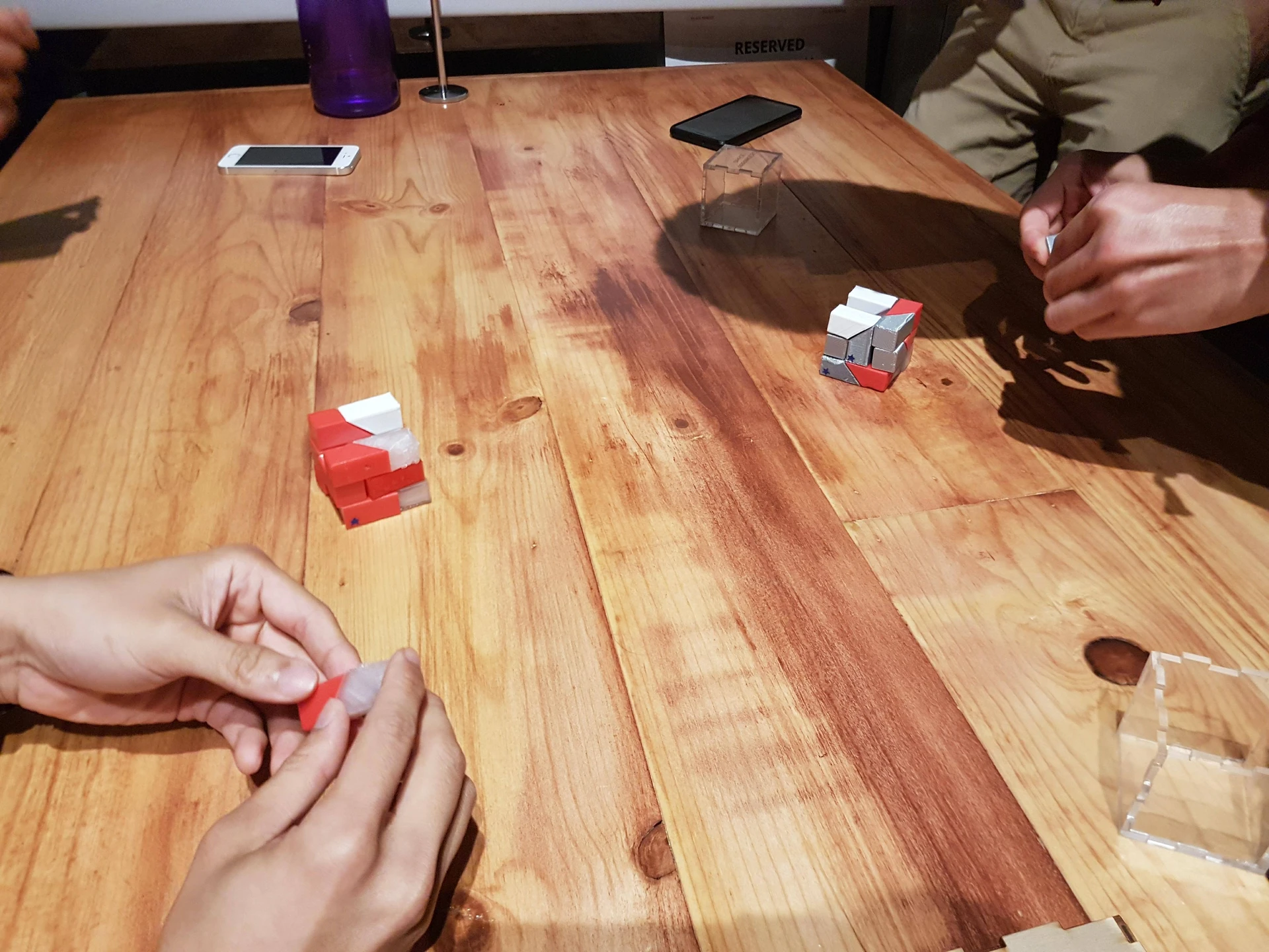 Players arranging pieces during a game